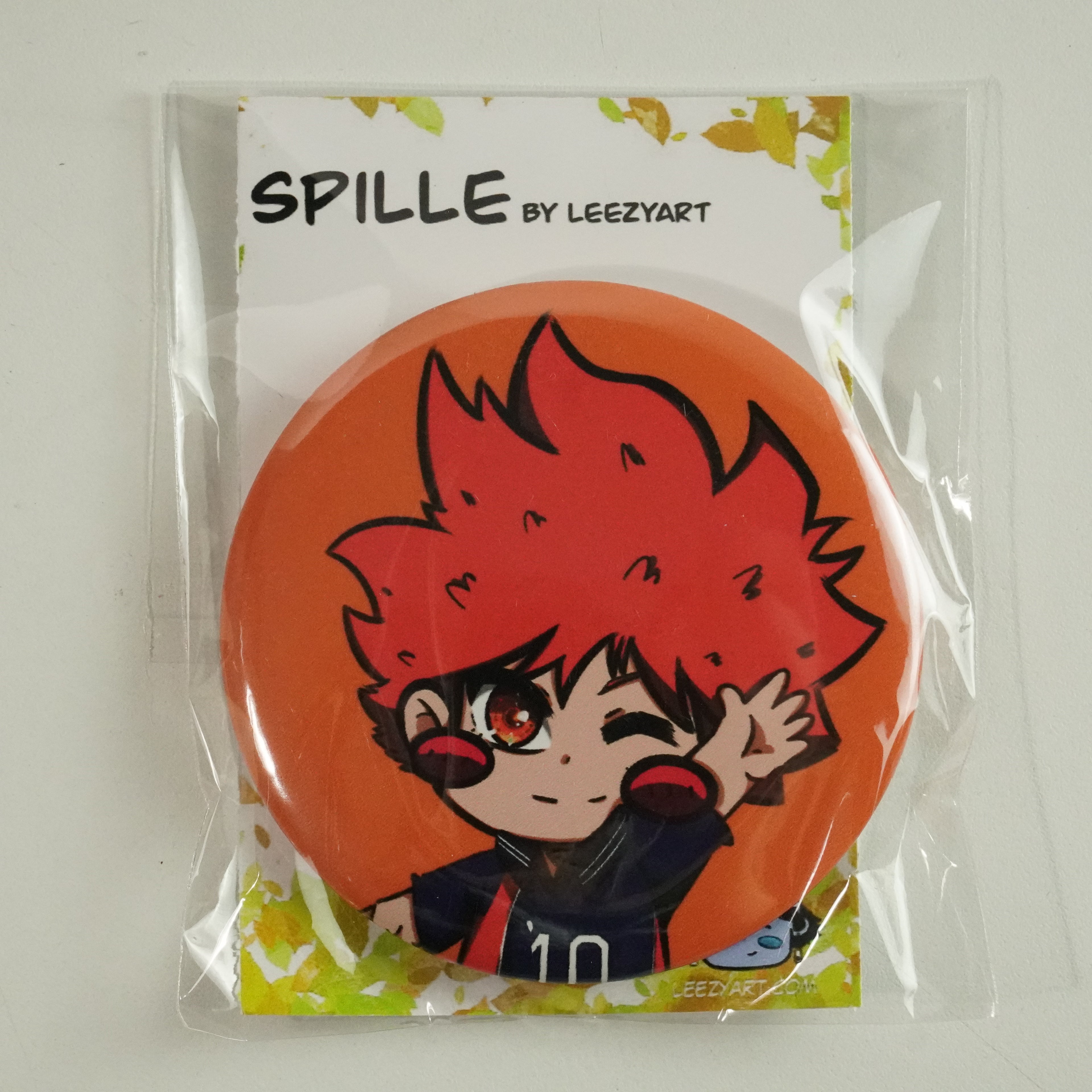 SPILLA TONDA VOLO ARANCIONE CHIBI